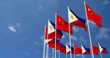 Philippines and China Flags Waving Together in the Sky, Seamless Loop in Wind, Space on Left Side for Design or Information, 3D Rendering video