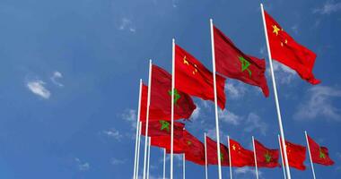 Morocco and China Flags Waving Together in the Sky, Seamless Loop in Wind, Space on Left Side for Design or Information, 3D Rendering video