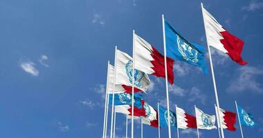 Bahrain and United Nations, UN Flags Waving Together in the Sky, Seamless Loop in Wind, Space on Left Side for Design or Information, 3D Rendering video