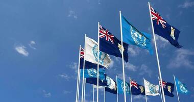 Anguilla and United Nations, UN Flags Waving Together in the Sky, Seamless Loop in Wind, Space on Left Side for Design or Information, 3D Rendering video