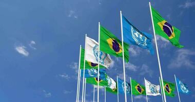 Brazil and United Nations, UN Flags Waving Together in the Sky, Seamless Loop in Wind, Space on Left Side for Design or Information, 3D Rendering video