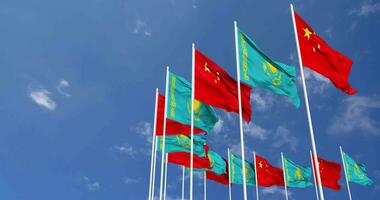 Kazakhstan and China Flags Waving Together in the Sky, Seamless Loop in Wind, Space on Left Side for Design or Information, 3D Rendering video