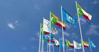 Comoros and United Nations, UN Flags Waving Together in the Sky, Seamless Loop in Wind, Space on Left Side for Design or Information, 3D Rendering video