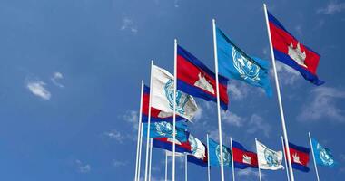 Cambodia and United Nations, UN Flags Waving Together in the Sky, Seamless Loop in Wind, Space on Left Side for Design or Information, 3D Rendering video