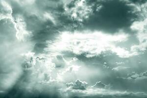 Gray and white fluffy clouds. Cloudy sky. White and gray texture background for sad, death, hopeless, and despair concept. Moody sky. Cloudscape. Dark dramatic sky. Background for dead and gloomy. photo