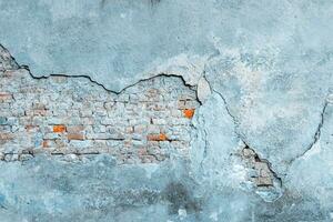 Peeling wallpaper. Old rough stone on cement pattern wall background. Vintage grunge plaster or concrete stucco surface. Natural material abstract structure backdrop. photo