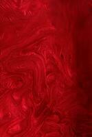 Vertical red shimmer abstract background. Make up concept.Beautiful stains of liquid nail laquers.Fluid art,pour painting technique.Horizontal banner,can be used as backdrop for chat. photo