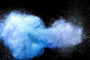 Closeup of blue dust particle splash isolated on black background. photo