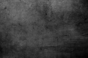 Grunge textured dark concrete wall background photo