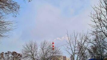 Slow motion of the steam coming out from the big chimney of the thermal plant. Industry video