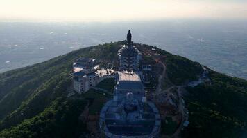 View of Ba Den mountain tourist area, Tay Ninh province, Vietnam. A unique Buddhist architecture with the highest elevation in the area view from below is very beautiful. video