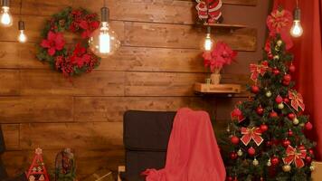 Christmas decorations in beautiful room with wooden walls. Happy holidays video