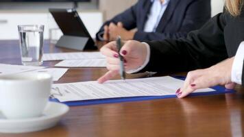 Signing a business contract in conference room at the desk. Close up dolly slider 4K footage video