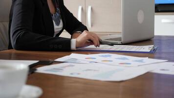 Businesswoman reading and signing a contract on the table in the meeting room. Dolly slider 4K footage video