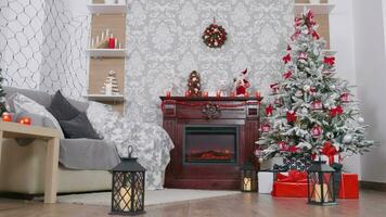 Beautiful room decorated with Christmas ornaments, tree and fireplace. Dolly shot video