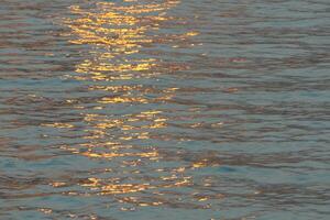 reflected sunlight ripples photo