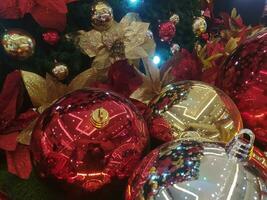 Red and yellow glass ball Christmas tree ornaments photo
