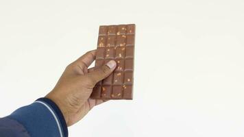 hand- Holding een donker chocola snoep video