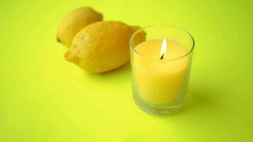 yellow color candle and lemon on black background video