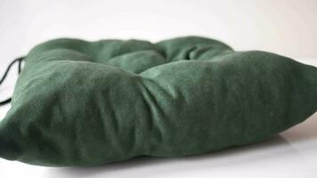 green color pillow on white bed video