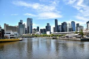 Melbourne, Victoria, Australia - 23 Dec 2023 - Yarra riveris with skyscraper view at Melbourne CBD, the capital of the Australian state of Victoria and the second-most populous city in Australia. photo