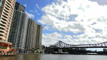 Brisbane, Queensland, Australia, - 6 January 2023 - The Story Bridge is a heritage-listed steel cantilever bridge spanning the Brisbane River with Skyscraper cityscape view in cloudy day. photo