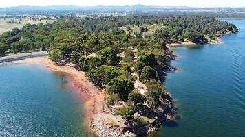 Aerial view of Jacksons point Bonegilla Victoria Australia with mountain view and lake hume water held by an awe-inspiring dam wall. photo