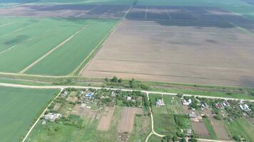 Top view of the village. One can see the roofs of the houses and gardens. Road in the village. Village bird's-eye view photo