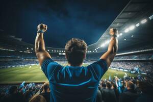 AI generated A football enthusiast in a blue shirt is captured from behind photo