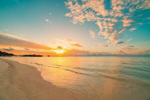 Summer beach vacation. Closeup Mediterranean sandy beach. Idyllic peaceful shore calm waves colorful sky, amazing panorama. Dream travel landscape. Relaxing sunset sunrise, horizon water reflection photo