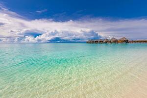 Maldives paradise island. Tropical aerial landscape, seascape long jetty pier water villas. Amazing sea sky sunny lagoon beach, tropical nature. Exotic tourism destination popular summer vacation photo