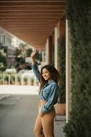 AI generated Happy young woman with thumbs up photo