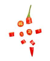 Top view of fresh red chili pepper slices isolated on white background with clipping path. chopped chili pepper photo
