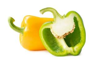 Fresh yellow bell or sweet paprika pepper with green half isolated on white background with clipping path photo