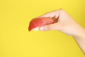 Hand with Sushi photo