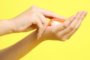 Hand with Sushi photo