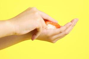 Hand with Sushi photo