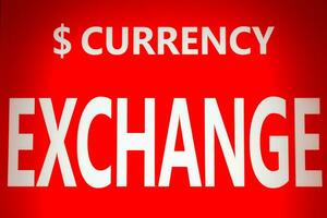 Exchange currency white text on red background photo