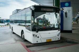 Bus stop at station in terminal photo