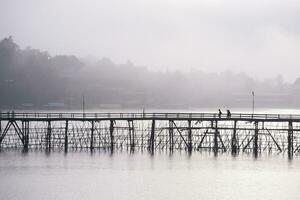 Wood Bridge across river photo