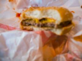 blur of bite hamburger photo