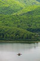 raft is floating on water in dam photo