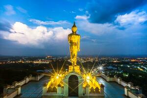 Golden buddha againts cloudy sky photo