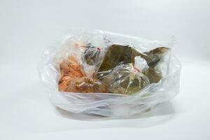 Plastic bag and food with white background photo