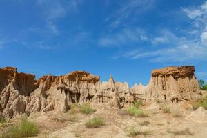 Soil mountain under clear sky photo