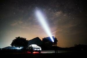 Night sky of milky way with car photo