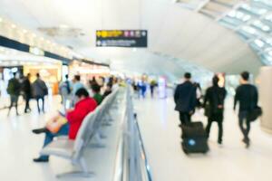 Blur of passenger walking  at airport building photo