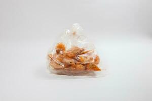 Plastic bag and food with white background photo