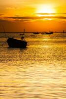 boats is floating under colorful sky at sunset time photo