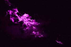 Violet flame. Burning of rice straw at night. photo